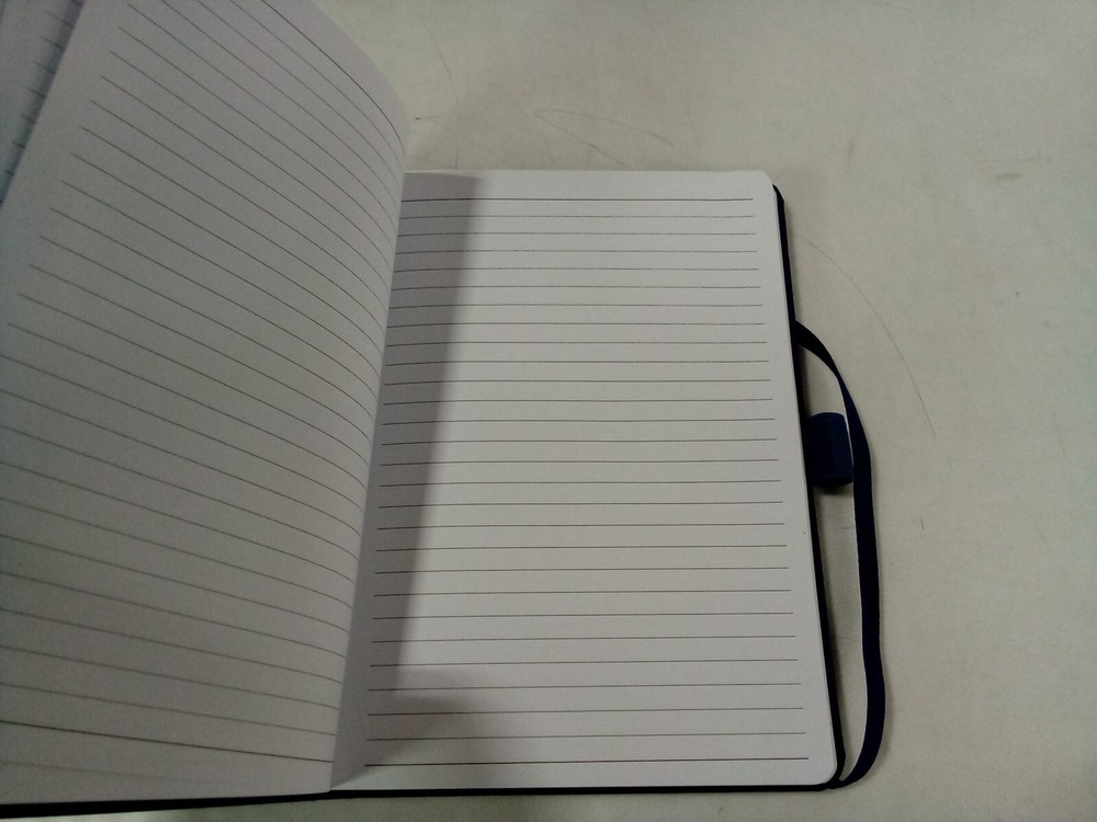 JournalBooks -blue debossed notebook, Flag Symbol