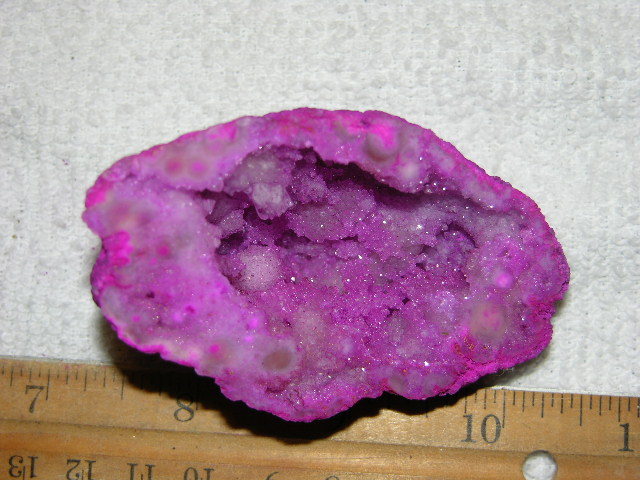 Geode cut & polished half with colored crystal center 3 inch E82