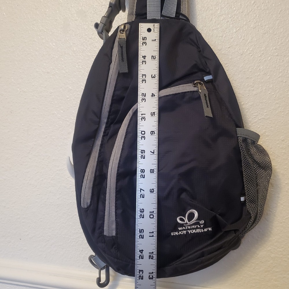 Waterfly Sling Pack - Black Gray Adjustable Strap Pockets Zippered NWT