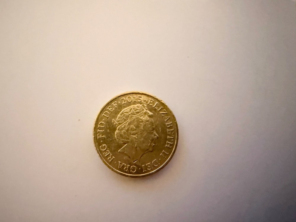 2015 Royal Arms One Pound Coin with minting error.
