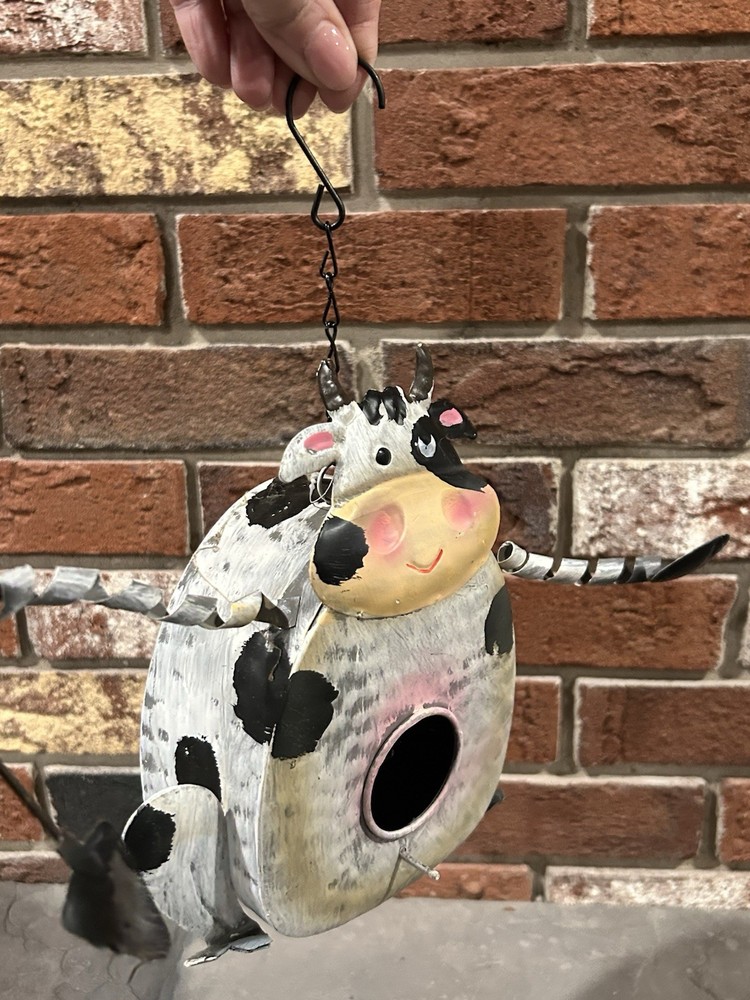 galvanized metal cow-shaped birdhouse