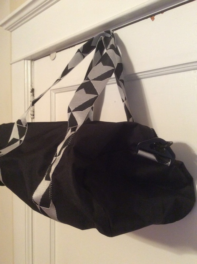 Twelve NYC black Duffel bag. Adjustable shoulder strap.
