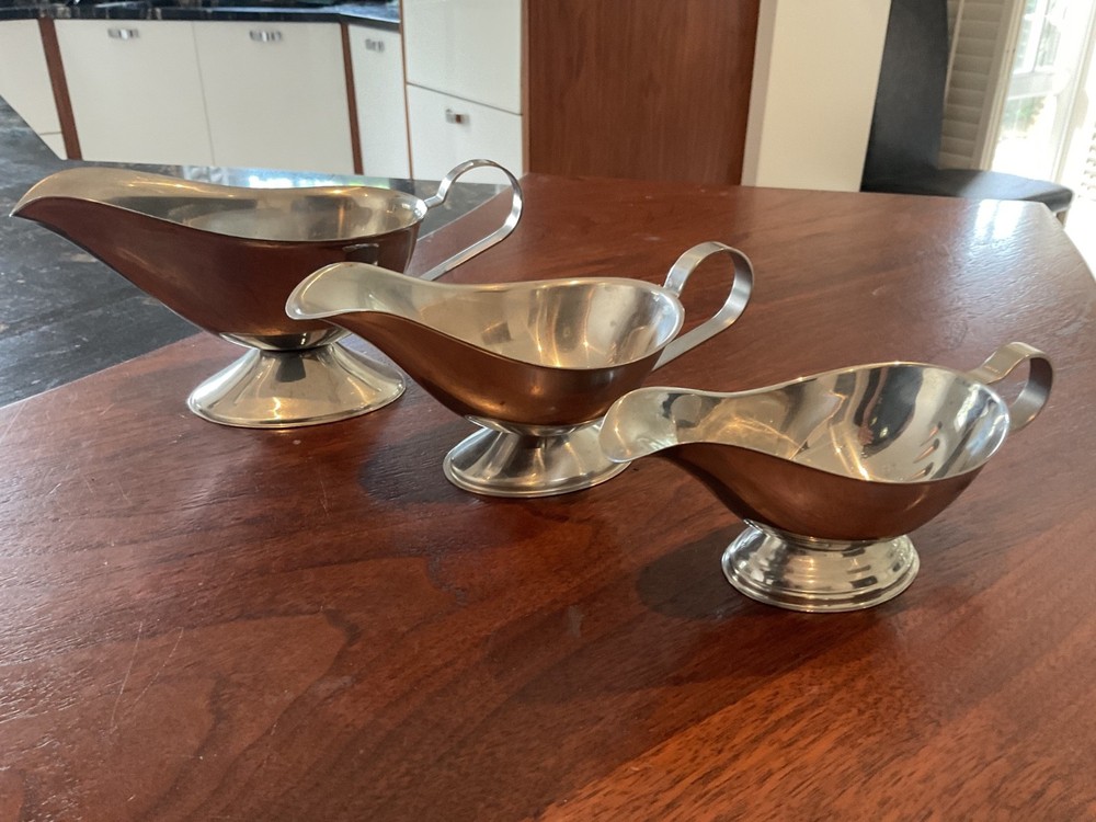 THREE SILVER COLOUR SAUCE BOATS GRADUATED