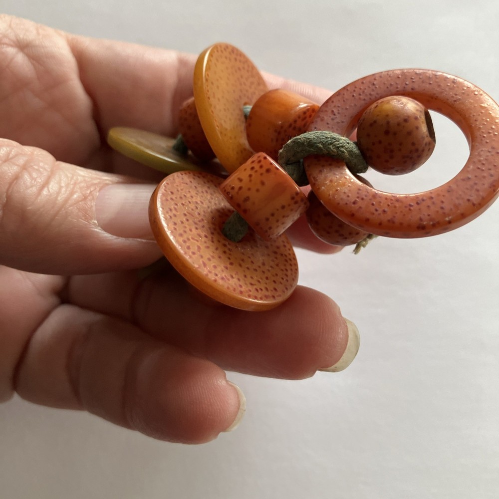1940’s Orange Green Speckled Bakelite Ring Crib Toy Teething Ring String