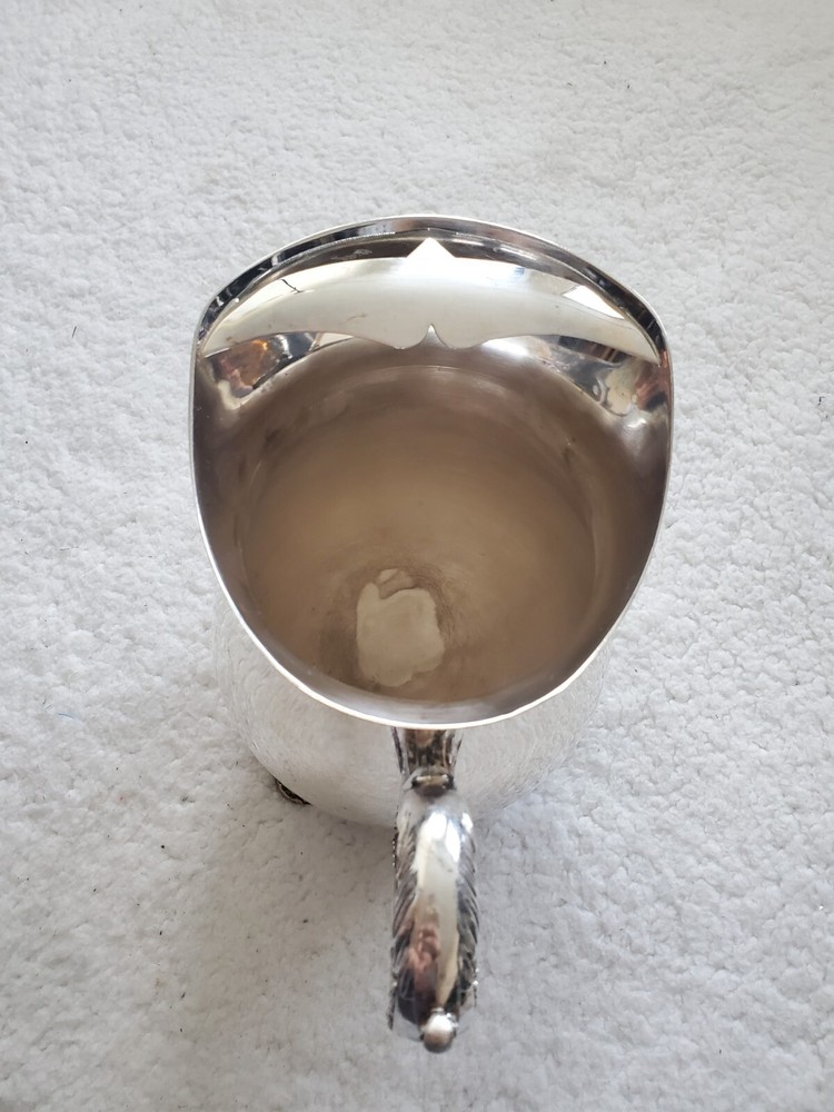 Cheeks Design &Art co. Silver plated footed pitcher