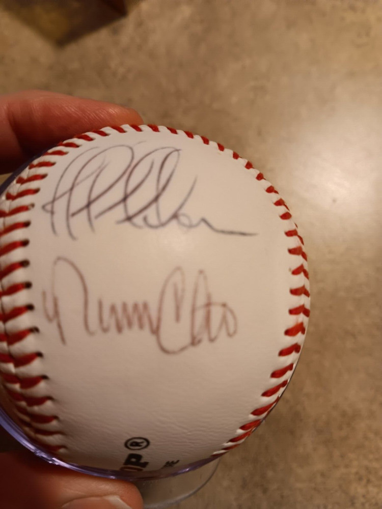 Baseball in case facsimile or real signatures in case