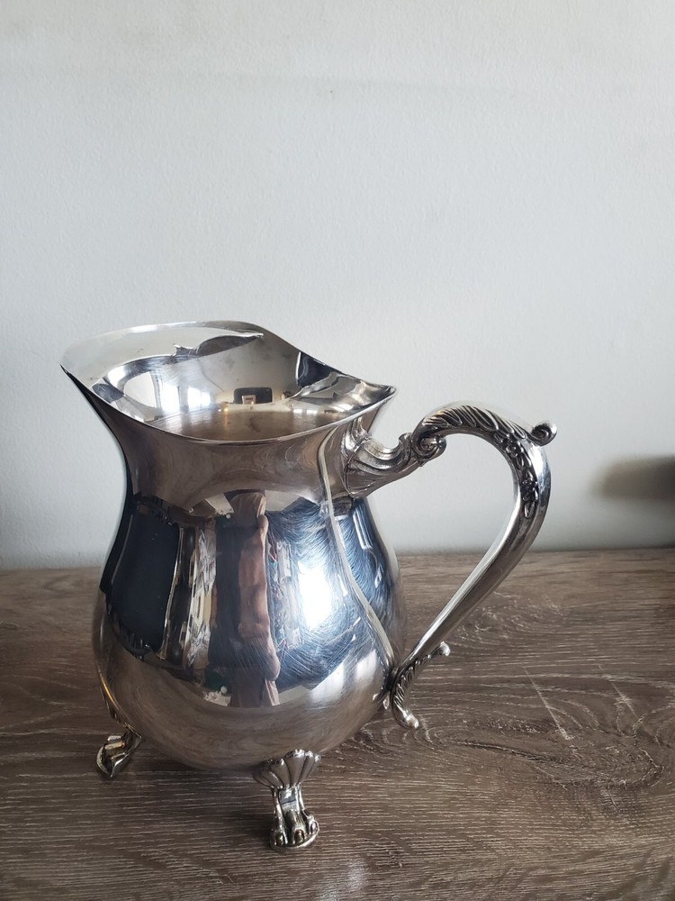 Cheeks Design &Art co. Silver plated footed pitcher