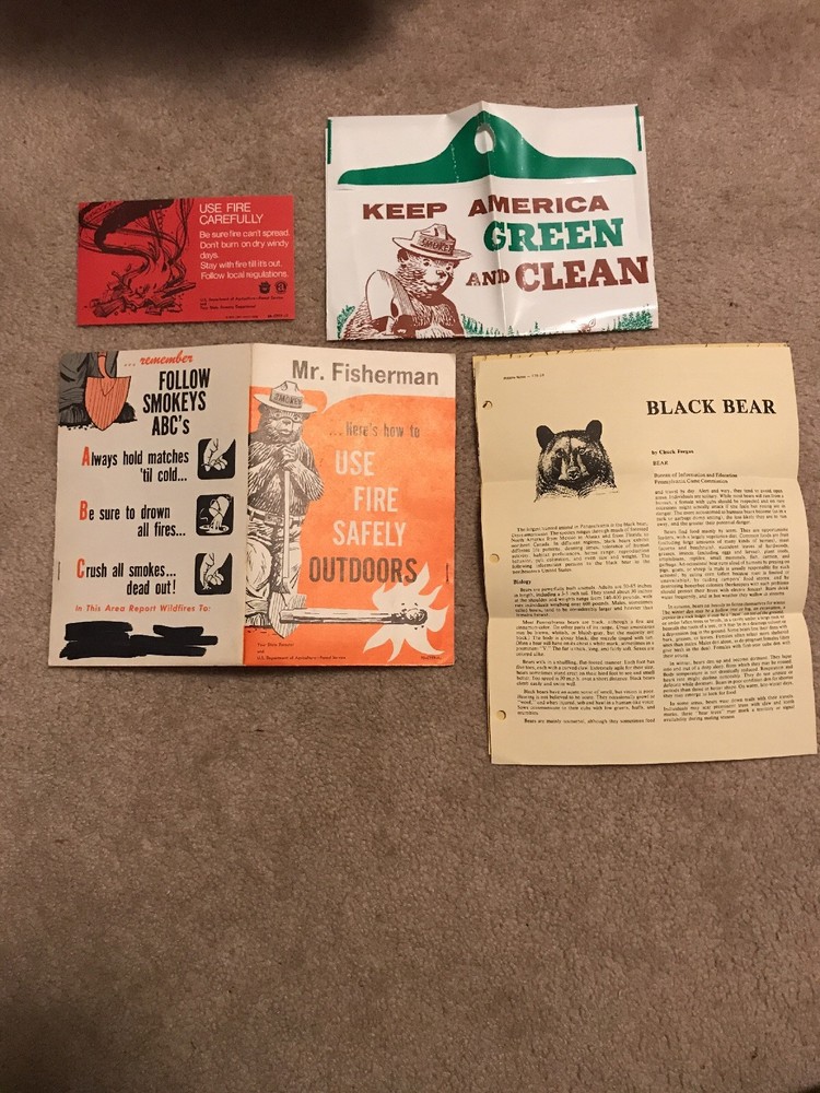 Smokey Bear "Mr. Camper Handout", plastic bag, black bear document, safety card
