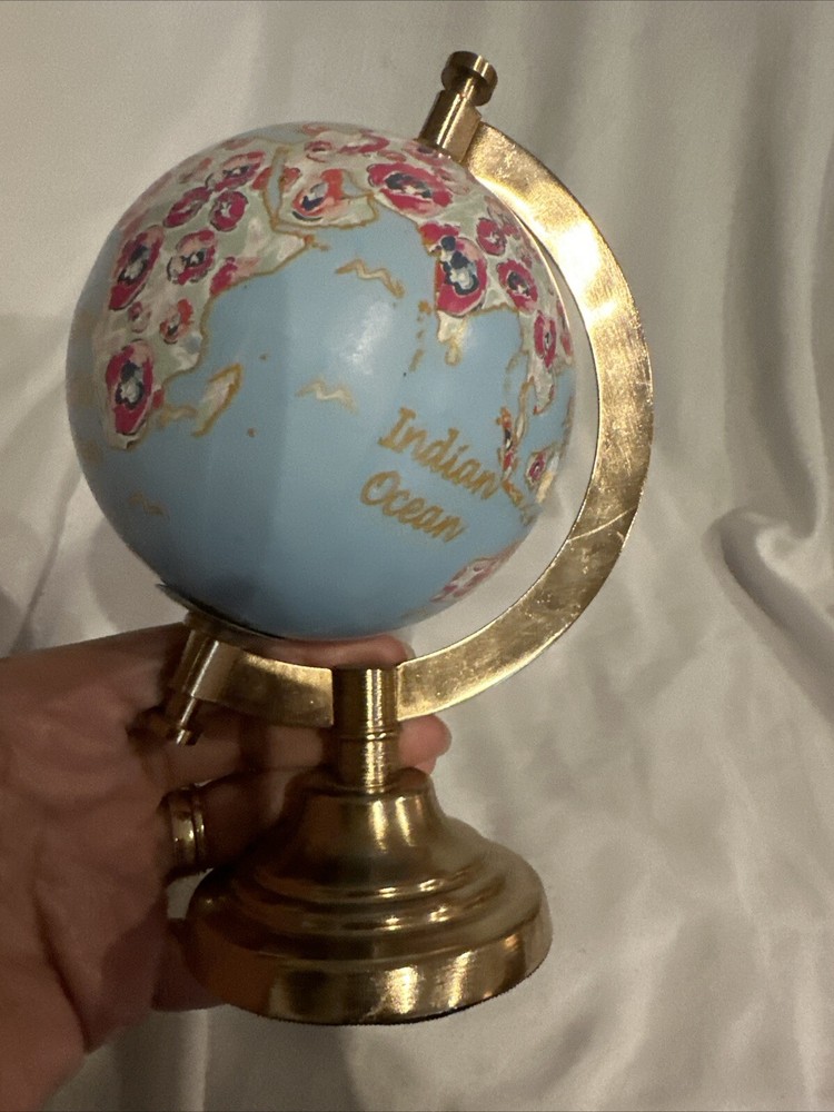 World Globe With Flowers By Threshold?