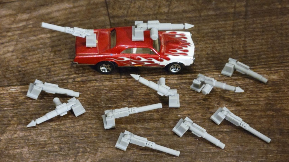 Adjustable, Moves Up or Down Weapons Pack Gray 3d printed. 1/64 scale. 11 items