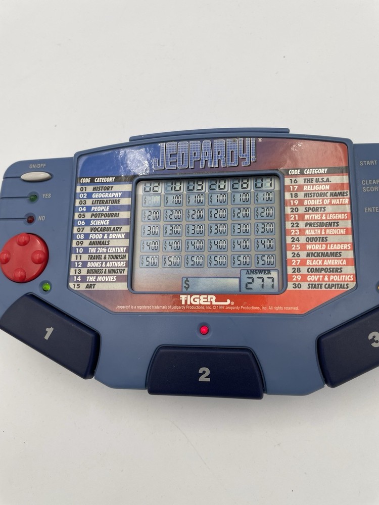 Tiger Electronics Jeopardy Hand Held Game 1995 with Answer Book & Manual E1