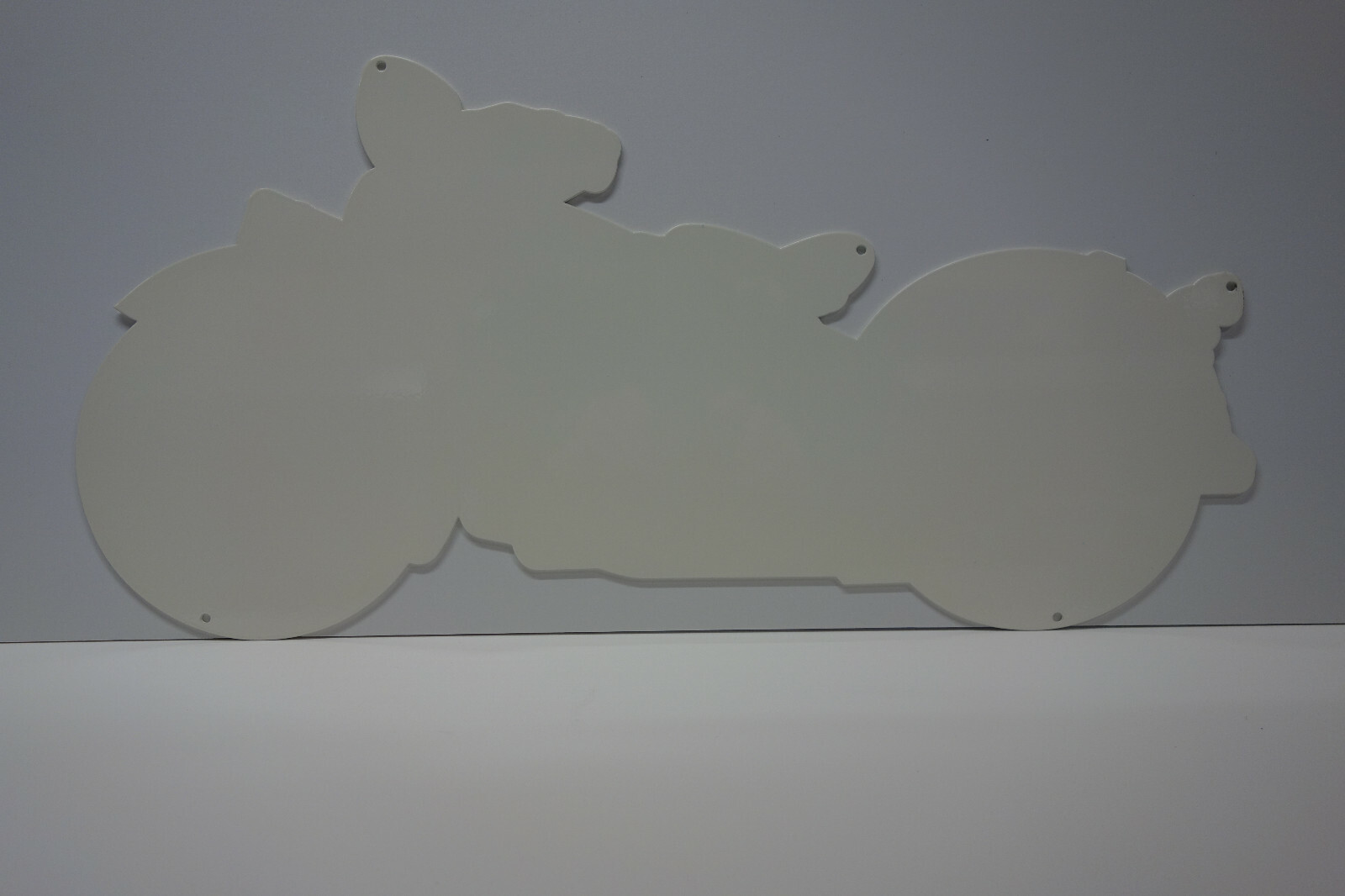 INDIAN MOTORCYCLE DIE CUT STEEL ENAMEL SIGN. 24" BY 11 7/8". VERY COLORFUL!