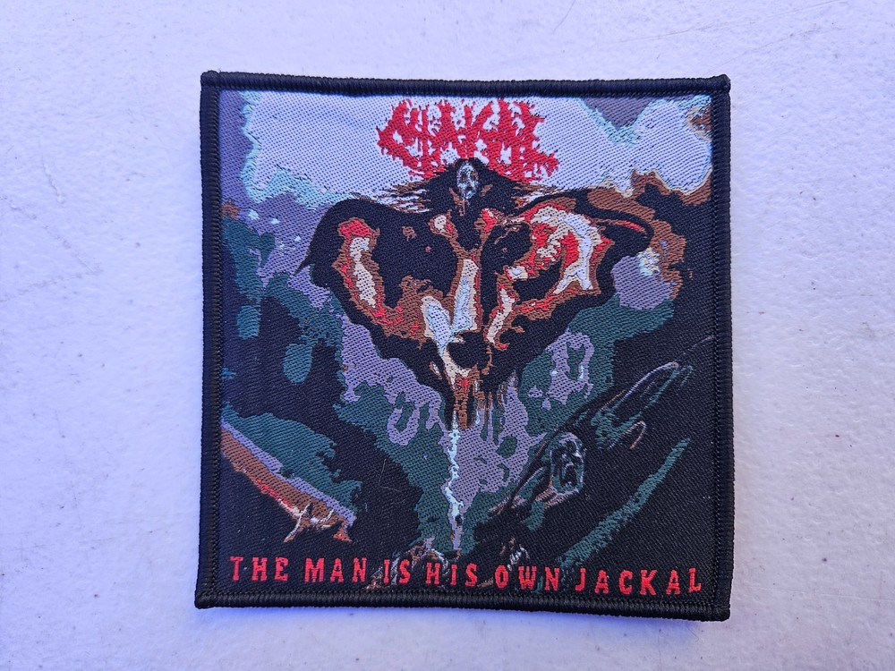 CHAKAL, THE MAN IS HIS OWN JACKAL, SEW ON BLACK  BORDER WOVEN PATCH