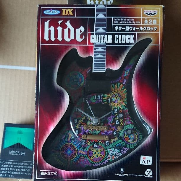 hide guitar shaped wall clock