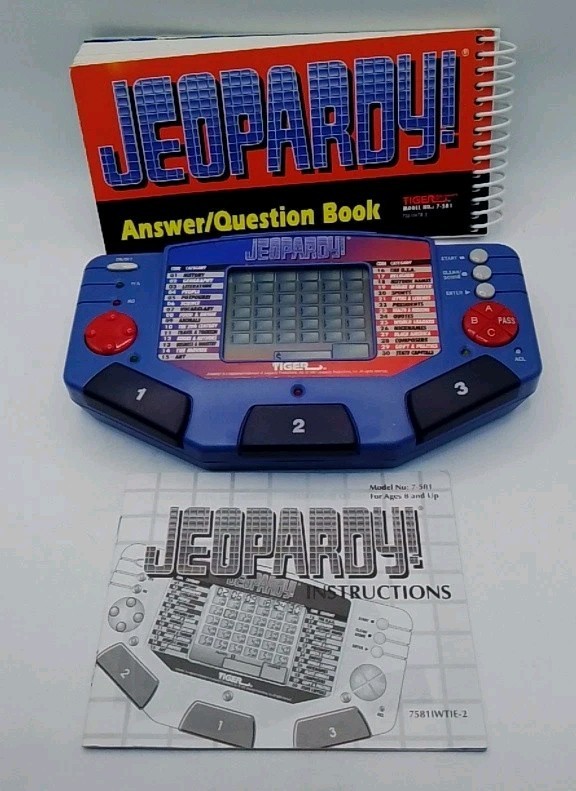 Tiger Electronics Jeopardy Hand Held Game 1995 with Answer Book & Manual