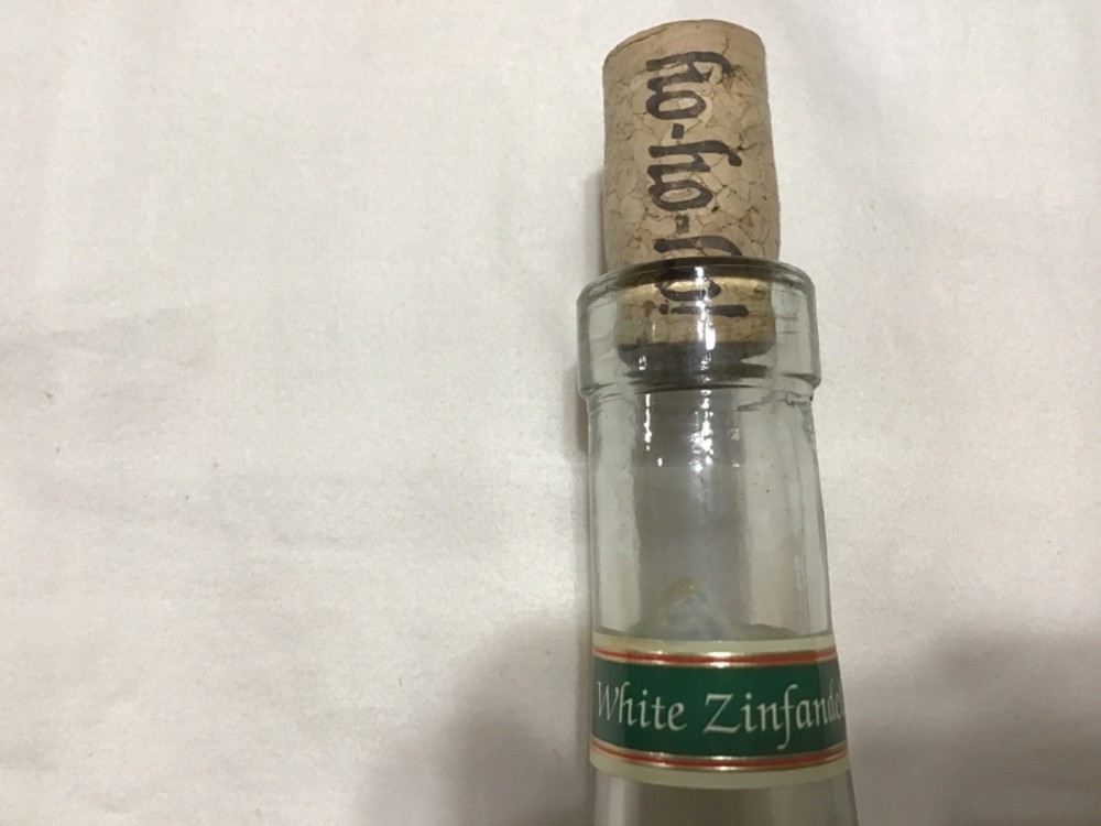 Christmas themed empty Chateau St. Nicholas wine bottle