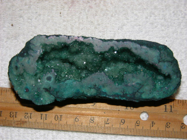 Geode cut & polished half with colored crystal center 4 inch E77