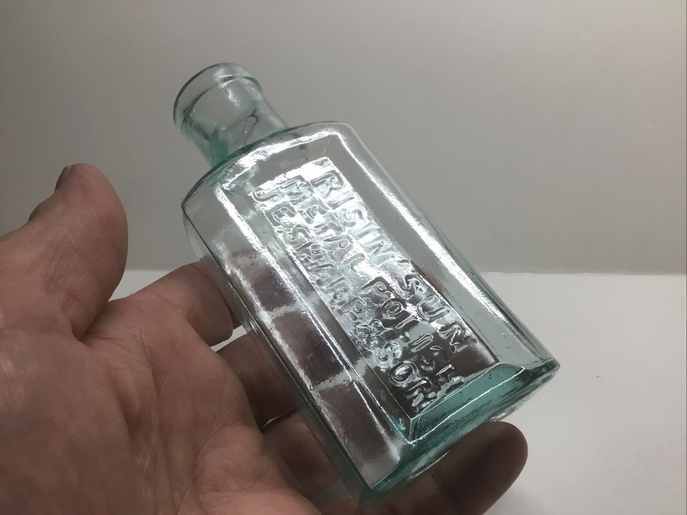 Small Antique Aqua Risin’ Sun Metal Polish Bottle. J. E. Sharp & Son.