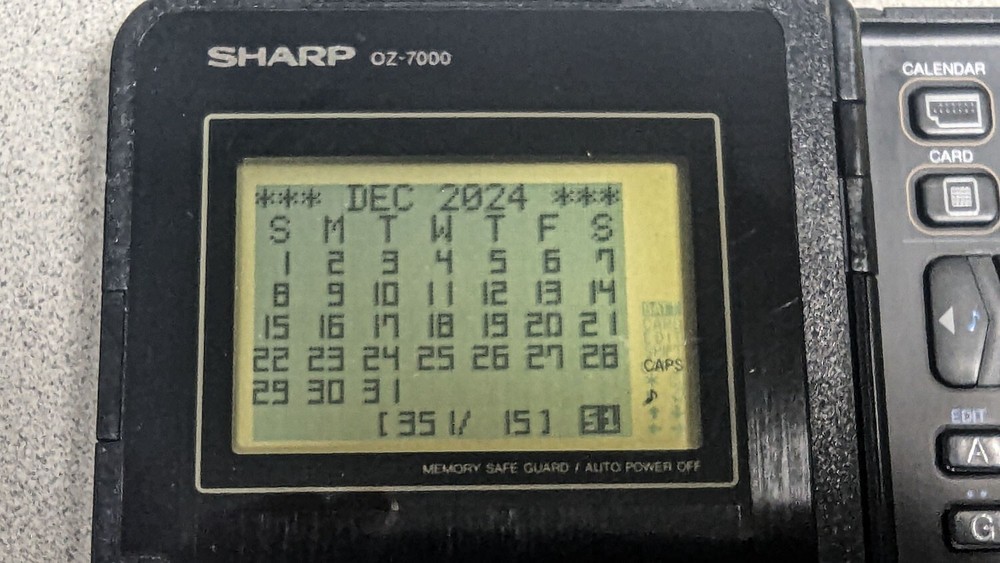 Sharp Wizard OZ-7000 Electronic Organizer with Time & Expense Manager Card