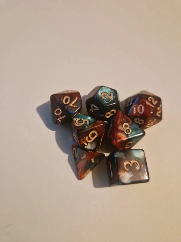 Green and red marble effect polyhedral dice set