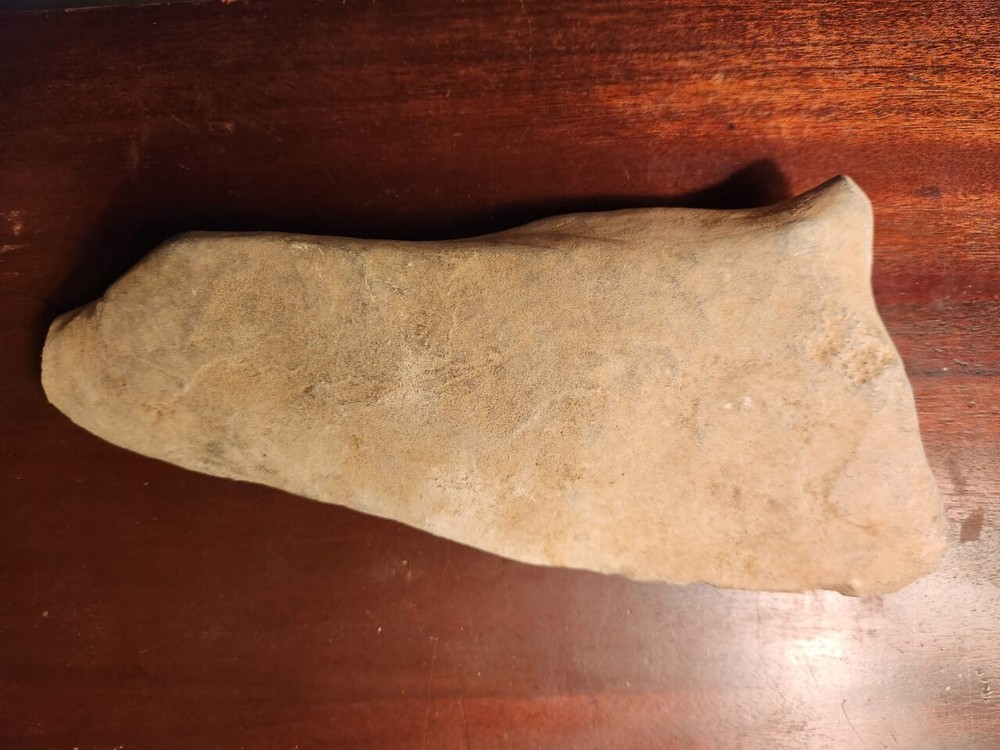 Large triangular Neolithic stone axe head from Niger