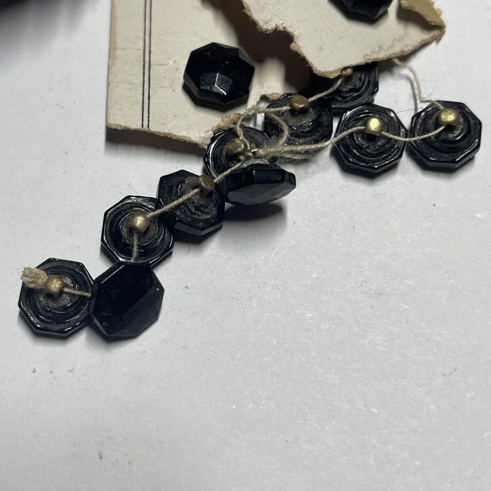 A Dozen Antique Black Glass Buttons