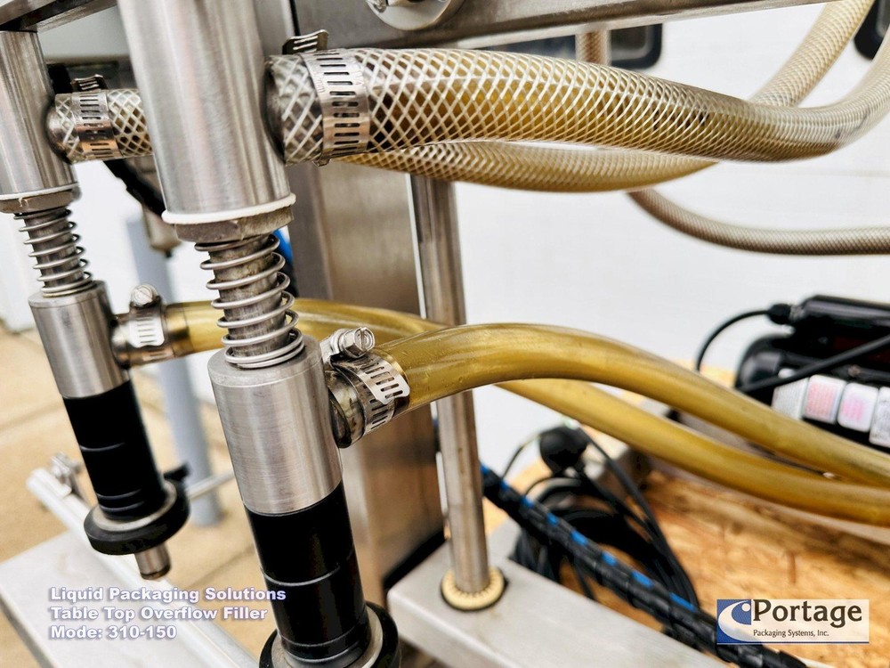 Liquid Packaging Solutions Model: 310-150 || Semi-Automatic Table Top Overflow