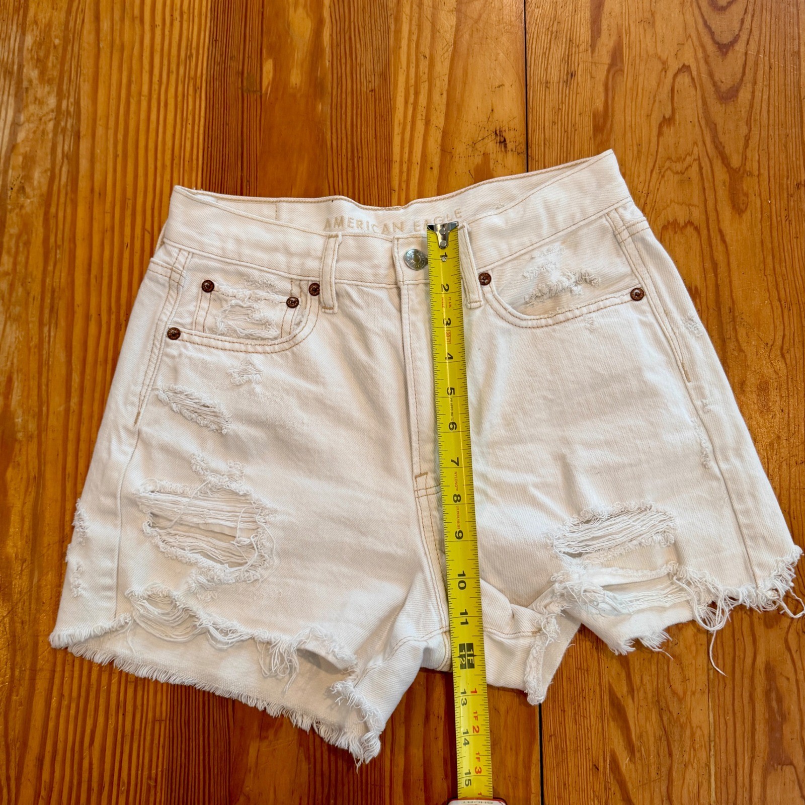 American Eagle White Distressed High Waisted Denim Shorts Size 4 Raw Hem