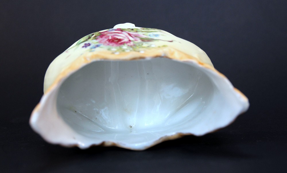 Vintage flared open sugar container with flowers on front. Unique shape