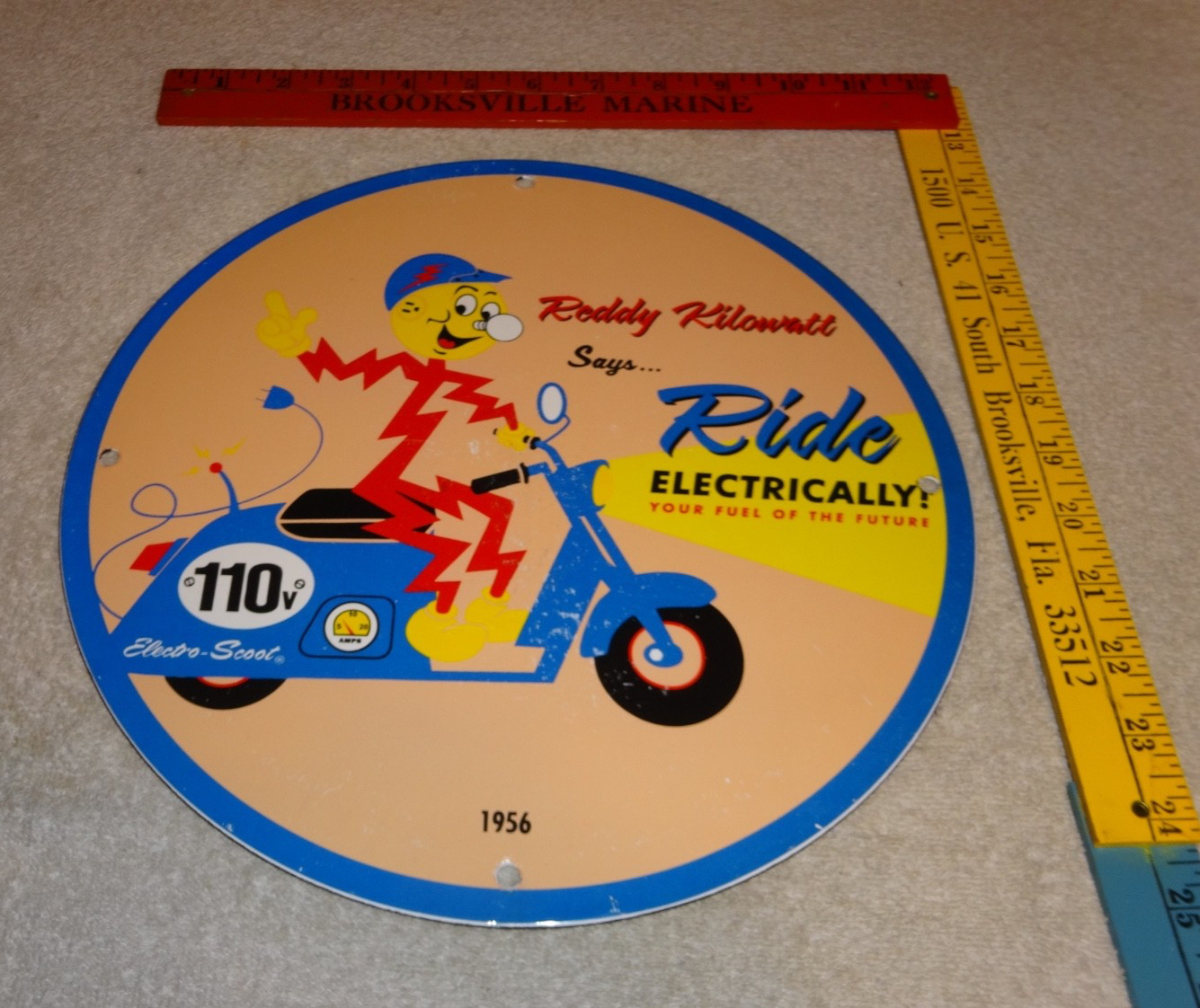 VINTAGE 56 REDDY KILOWATT ELECTRIC SCOOTER 11 3/4" PORCELAIN METAL GASOLINE SIGN