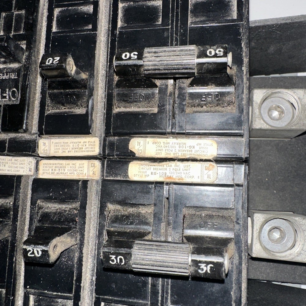 Electrical Load Center, service panel interior containing GE circuit breakers