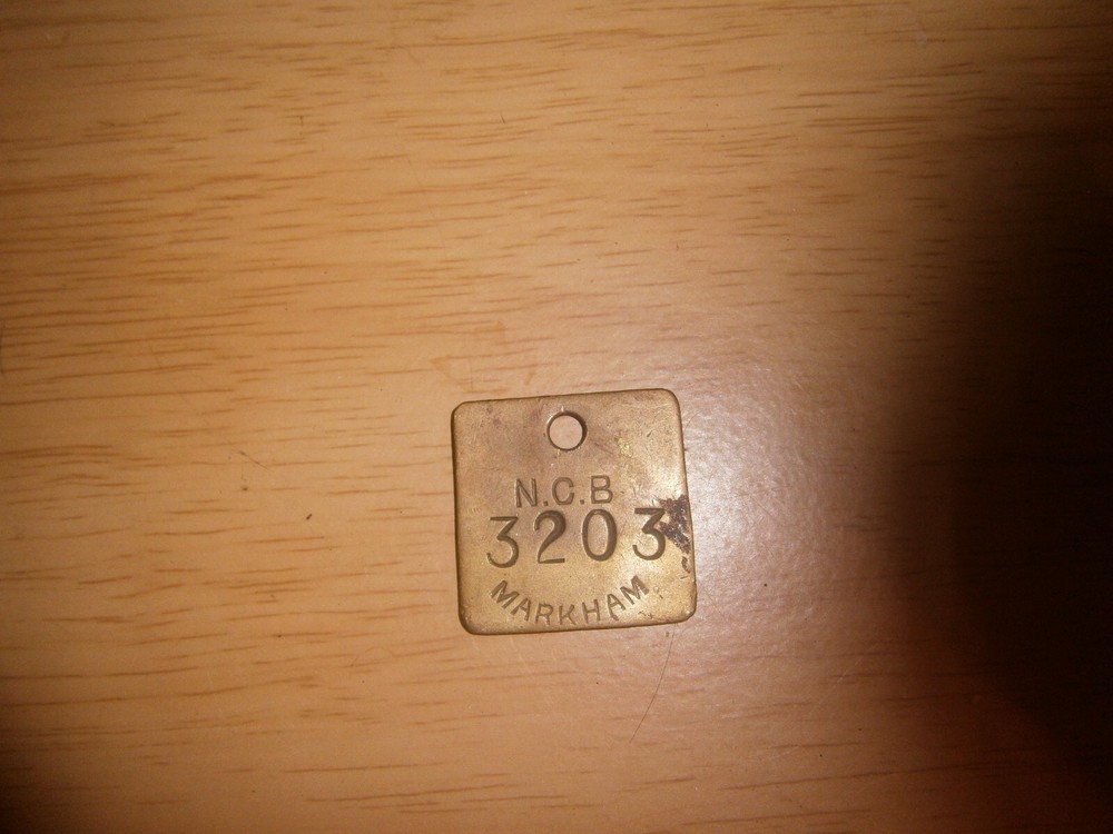 Mini brass plaque curio 3.2cm square. 'N.C.B. 3203 Markham' (E5b)
