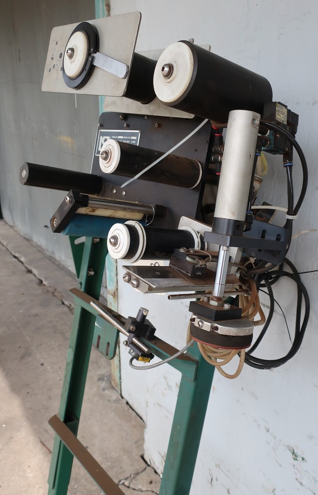 LSI Model 306 Pressure Sensitive Top Labeler Used