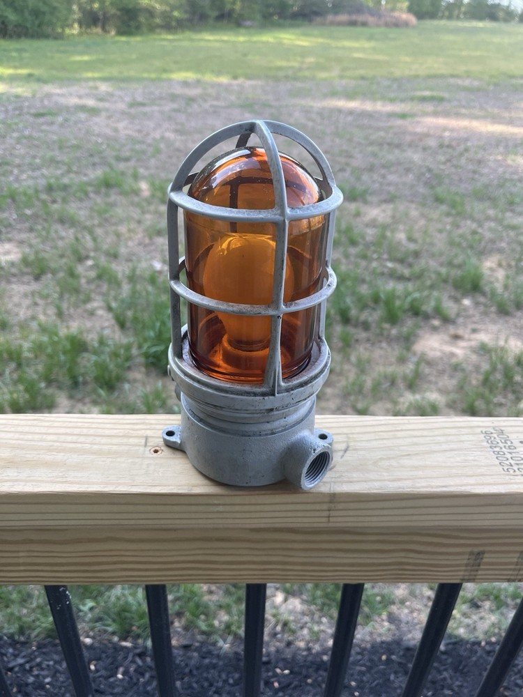 APPLETON FORM 100 EXPLOSION PROOF LIGHT W/ CAGE And GLOBE AMBER COLOR. Untested