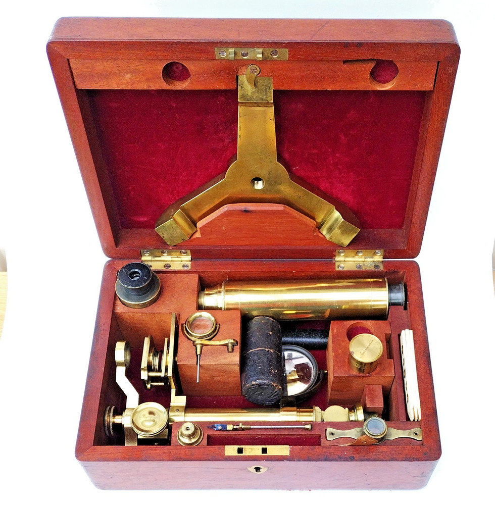 Brass microscope in case.