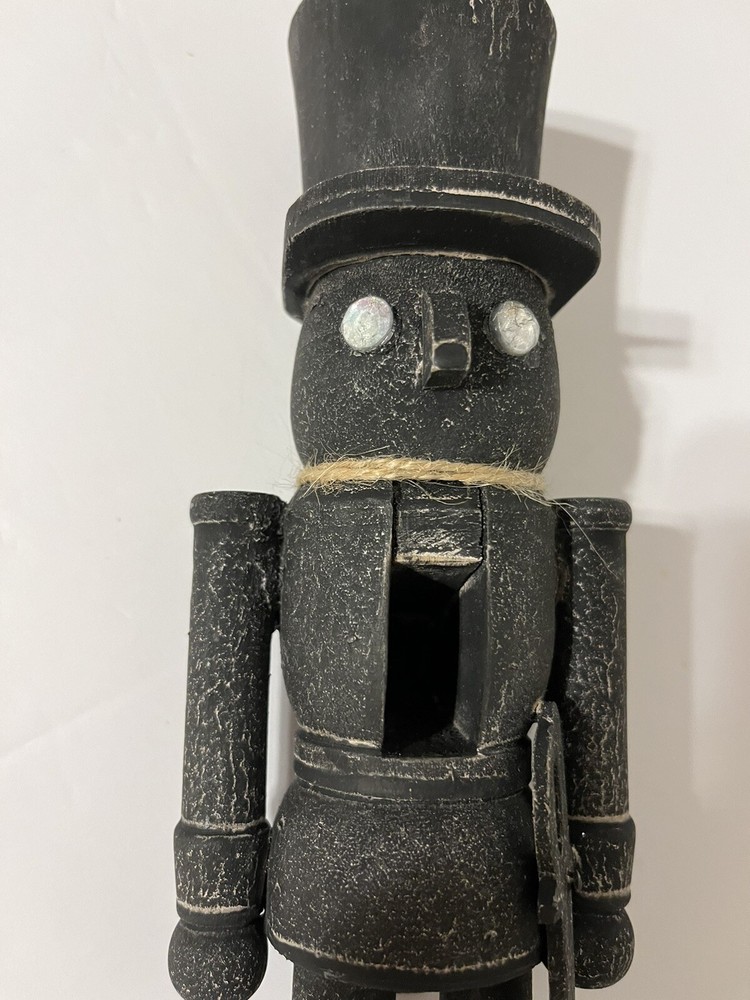Black washed wooden folk art nutcracker
