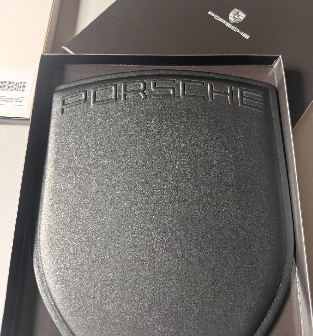 PORSCHE DESIGN EMBOSSED LEATHER COMPUTER MOUSE PAD IN THE SHAPE OF PORSCHE CREST