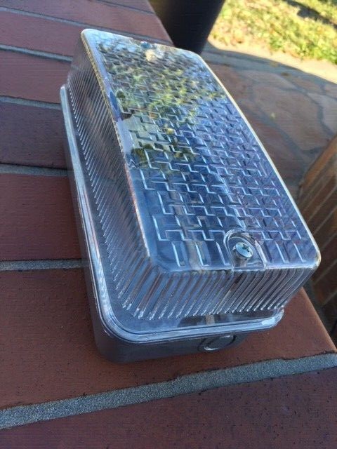 A WALL SECURITY FIXTURE WITH 9 WATT LED LIGHT BULB