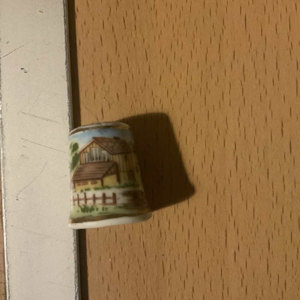 8 thimbles plus a wooden stand