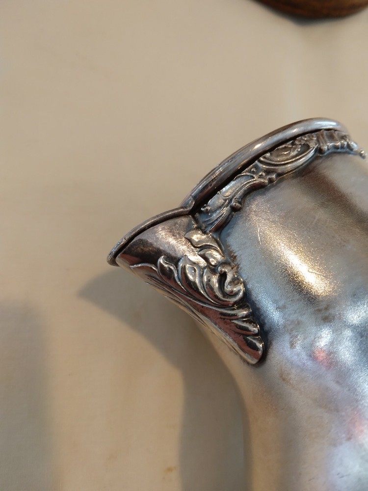 Beautiful small antique silver plated or silver pitcher.