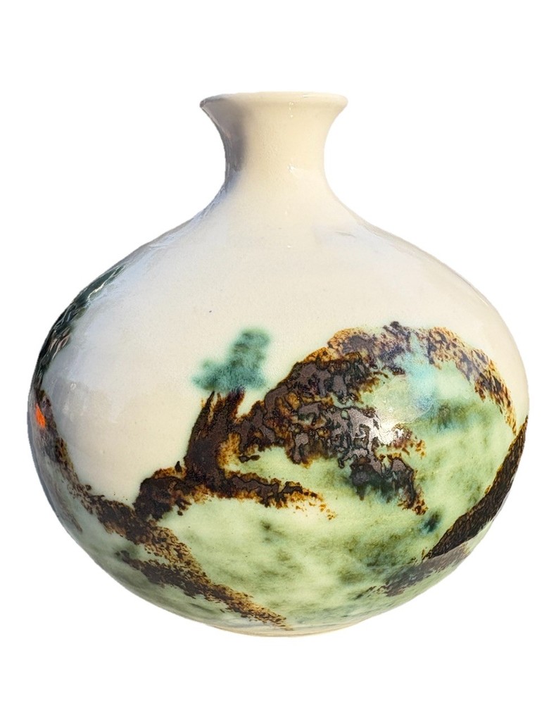 ceramic vase with an "Evergreen" design, featuring a water etching