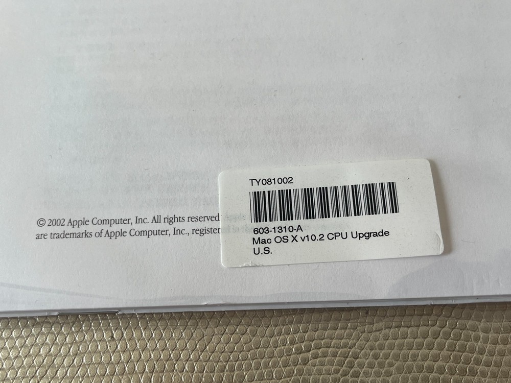 Mac OS X 10.2 Jaguar install discs + developer tools disc and Mac OS X manual