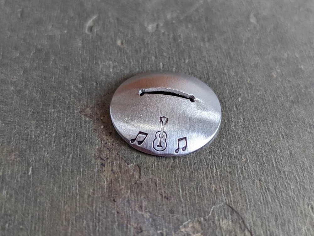 Sterling silver guitar pick stand with guitar and music notes