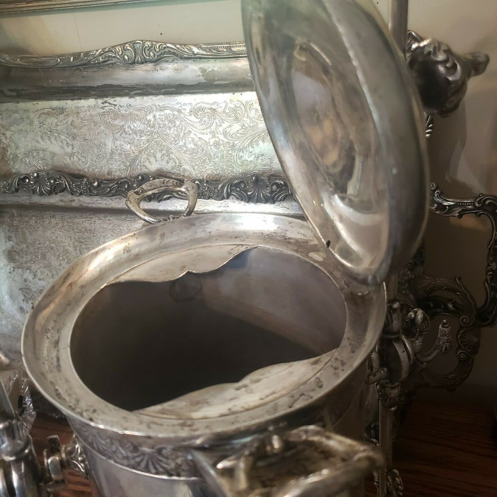 James W. Tuft silverplated tilting water pitcher. 20" tall. 