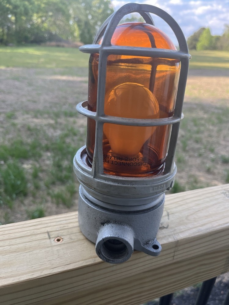 APPLETON FORM 100 EXPLOSION PROOF LIGHT W/ CAGE And GLOBE AMBER COLOR. Untested