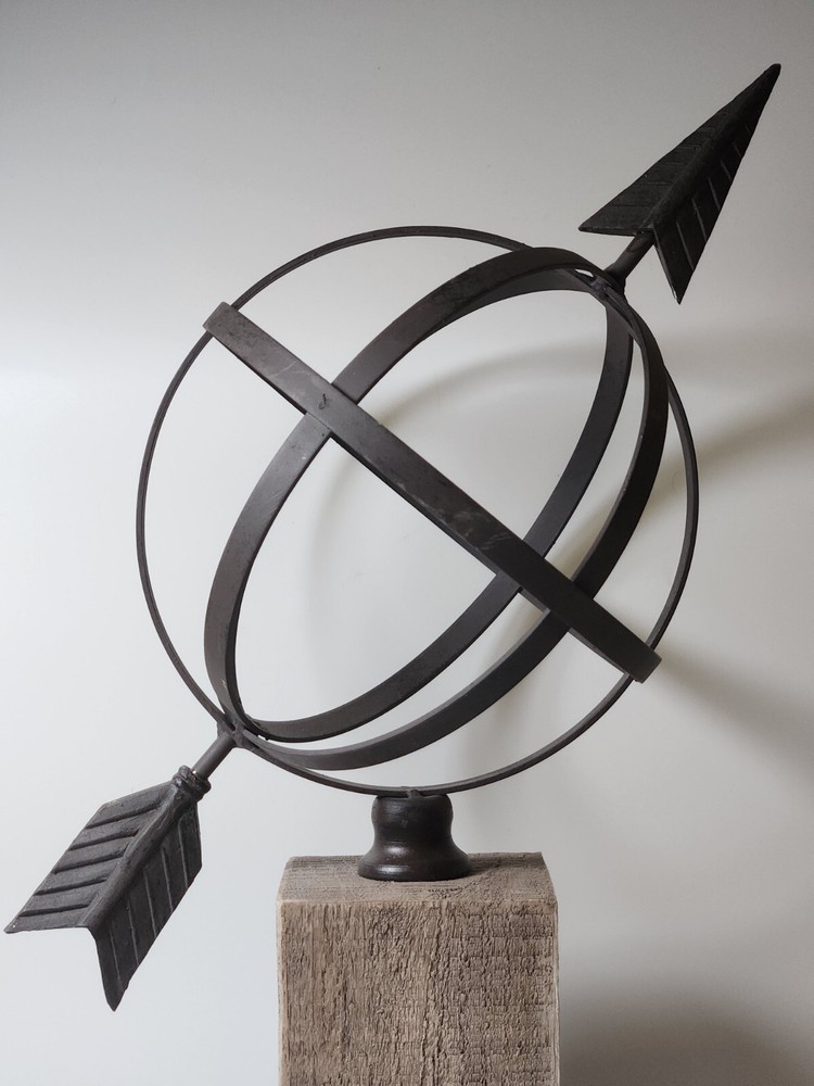 Metal Orb And Arrow Decor On Standing Base