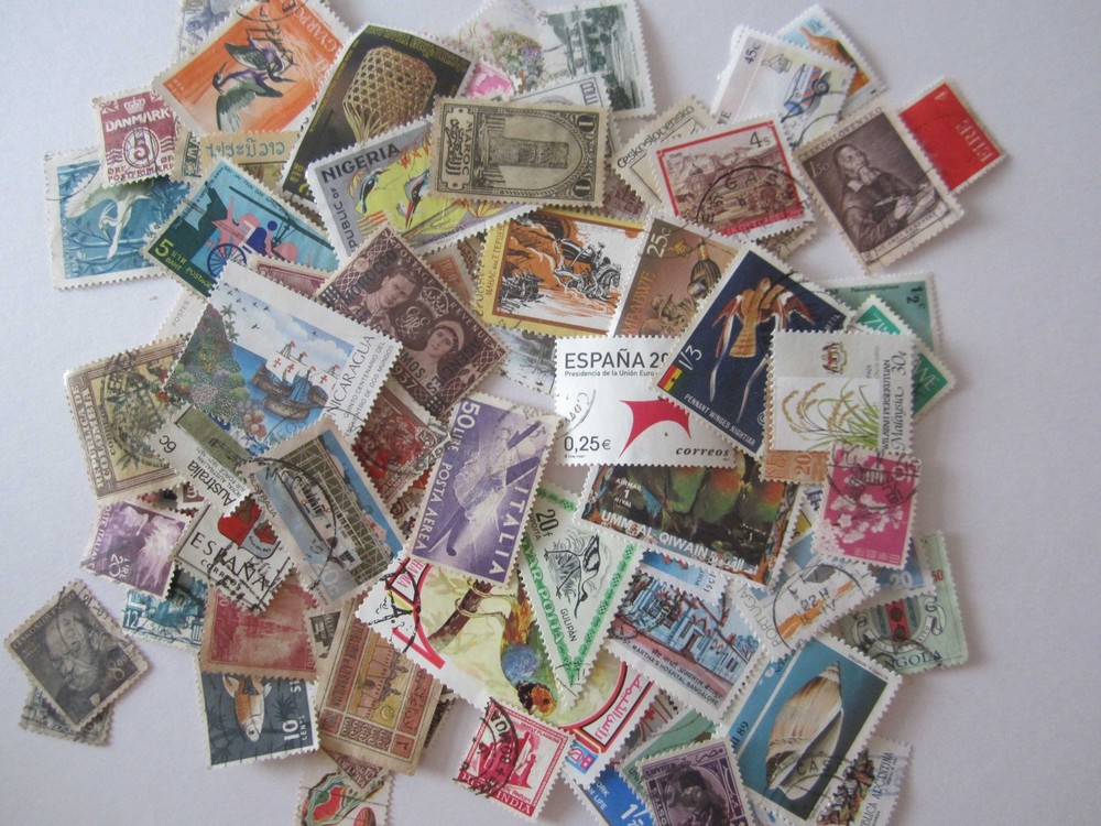 100 different World Mix Postage Stamps off paper