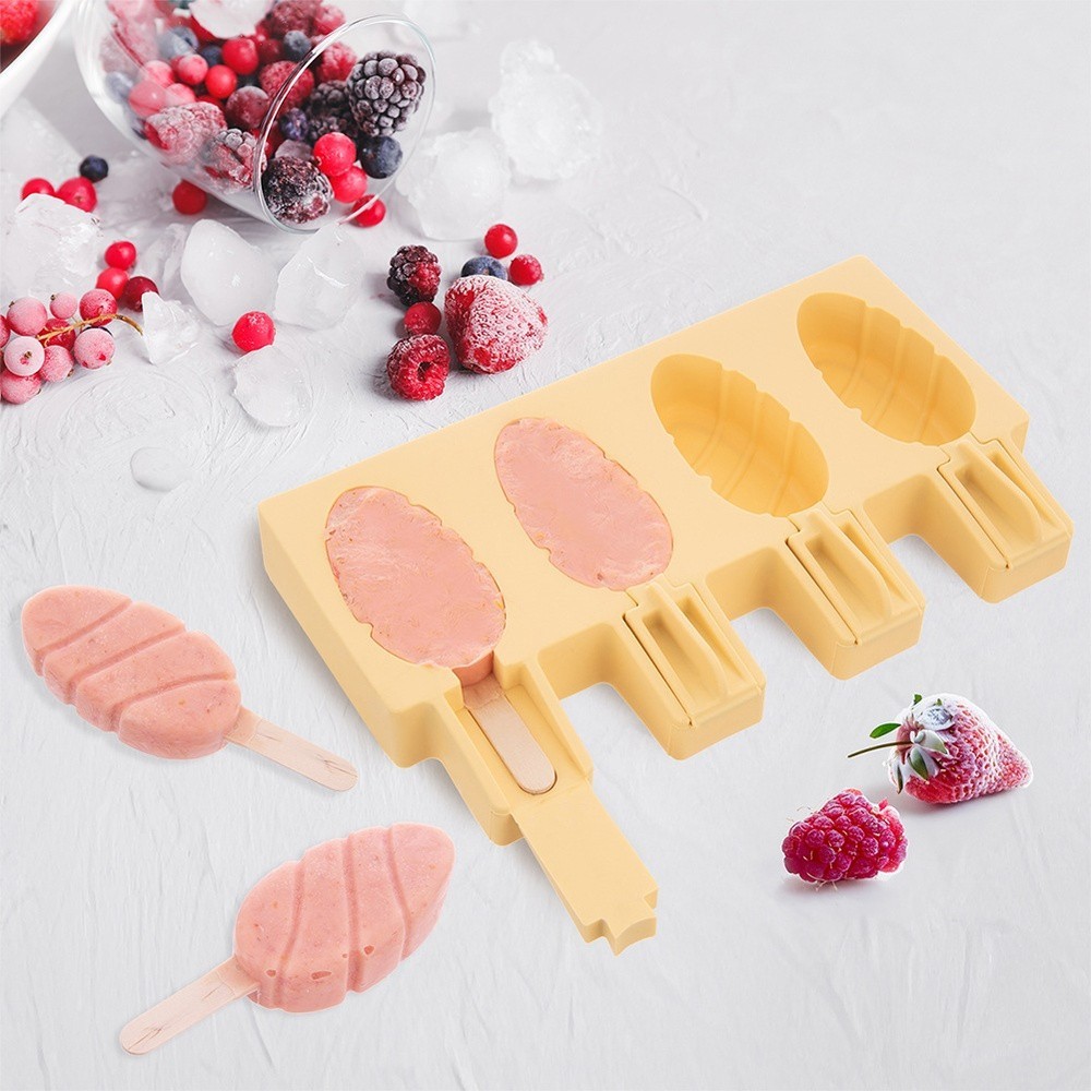 Yellow silicone ice pop molds with lids