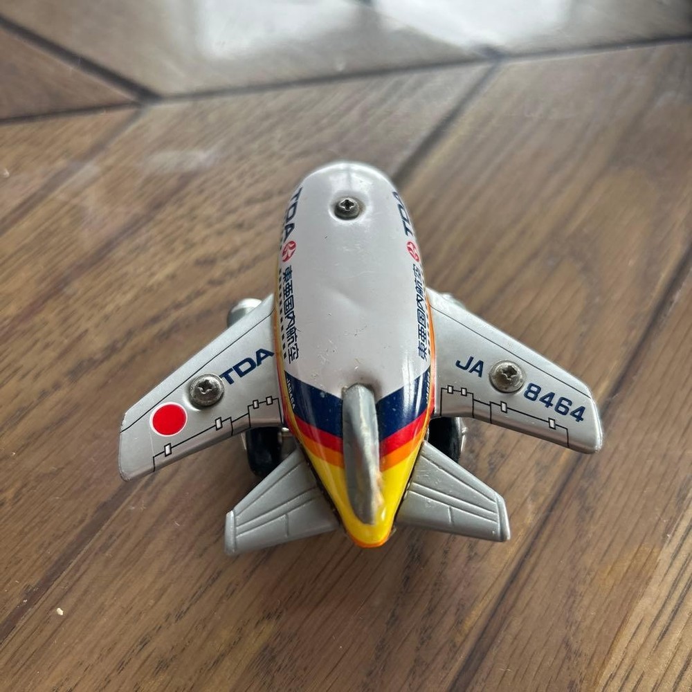 TDA miniature airplane tin