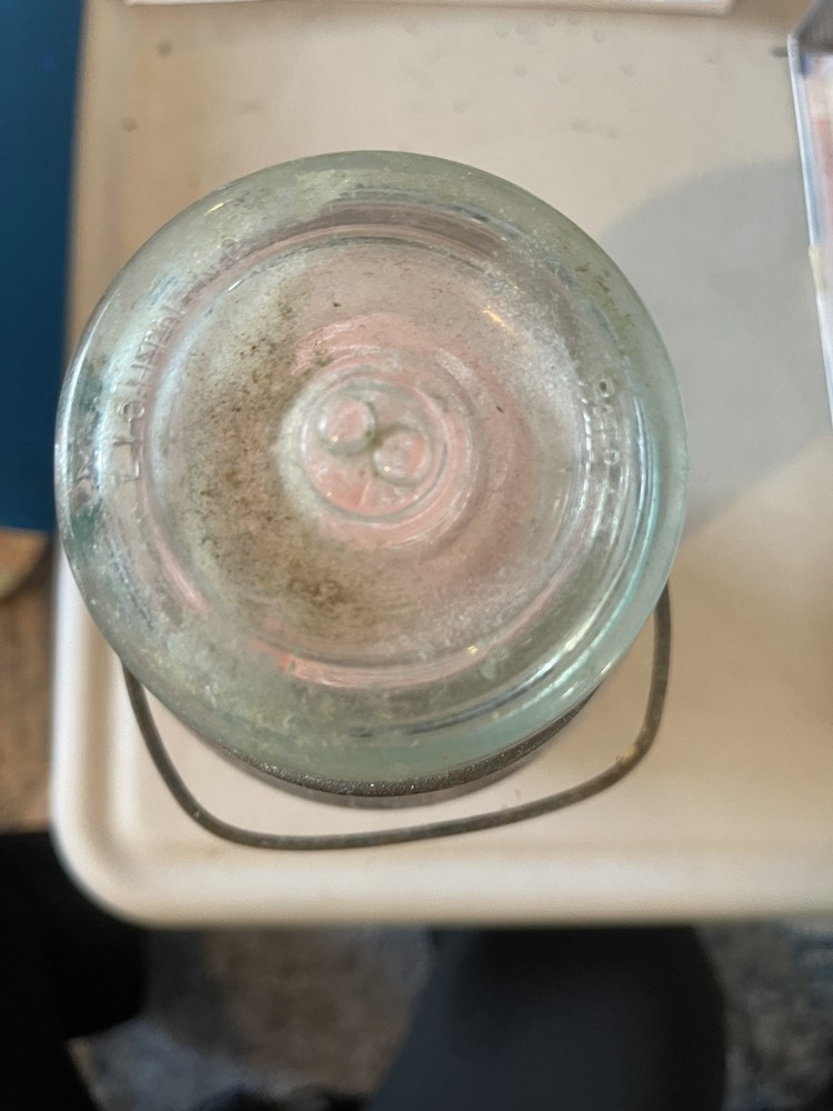 Antique Hair Rollers In Jar